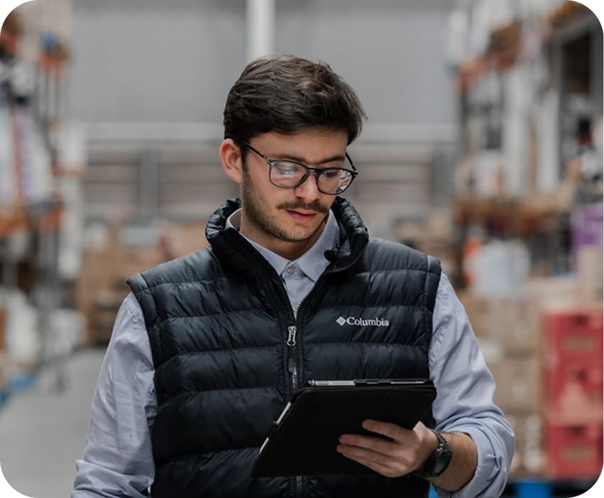 Supervisor reviewing production on a tablet